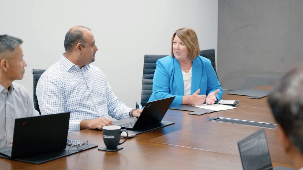 A Culture of Growth – Golub Capital Employees in a Conference Room